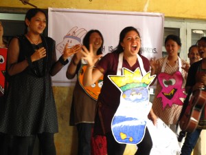 Lisa playing the "germ king" in a production of Hath Mein Sehat's health and hygiene education program at a primary school performance in Hubli, Karnataka. 