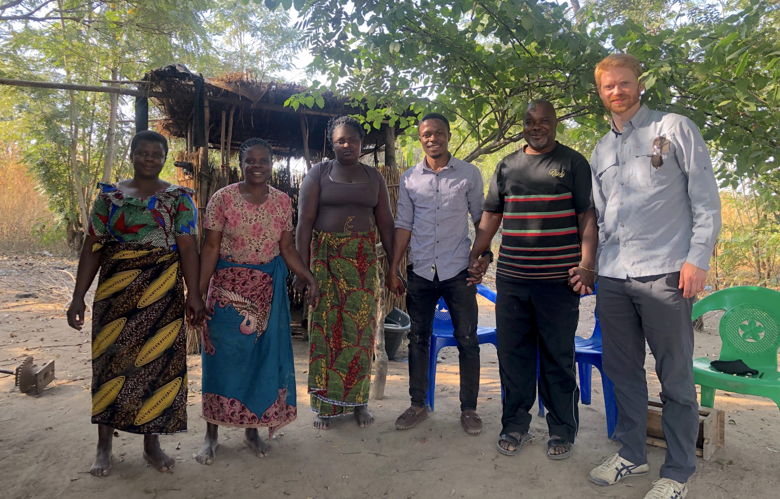 Three of the 11 members of the Yankho women's co-op (left), the backbone of and inspiration for Umodzi, along with Brian Ndongera (third from right), an advisor to Umodzi, Mathews Tisatayane (second from right), founder and president, and Sean Mandell, co-founder and CEO. (Umodzi photo)