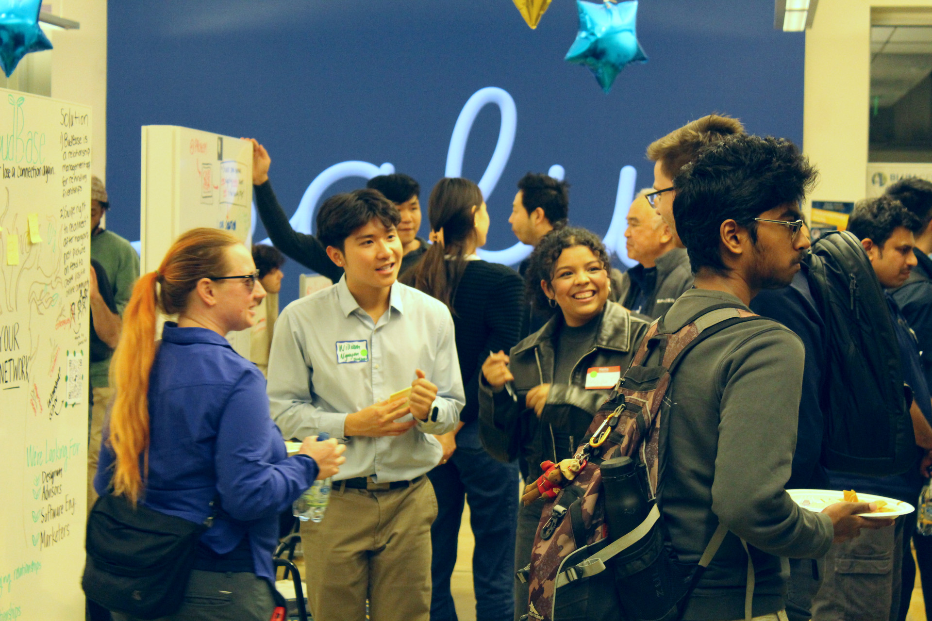 Student entrepreneurs and attendees gather in Blum Hall for a networking and brainstorming session. (Sam Goldman photo)