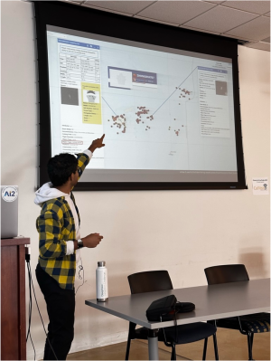 During a class presentation, Ritwik Gupta points to dark vessel detections generated from his xView3 AI model within the Department of Navy's SeaVision platform.