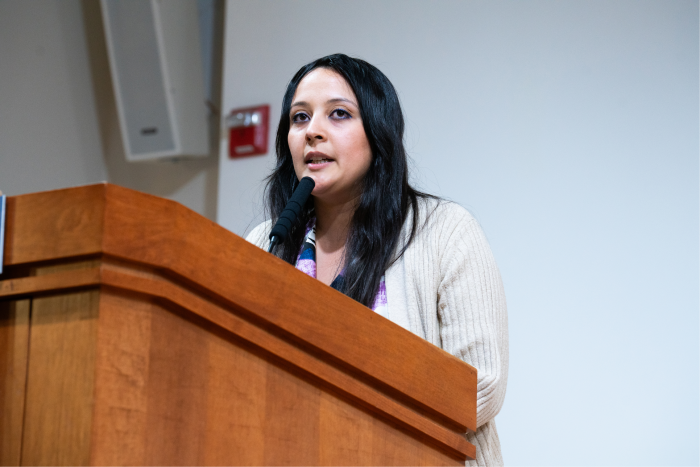 Quiona Trimmell speaking at a podium