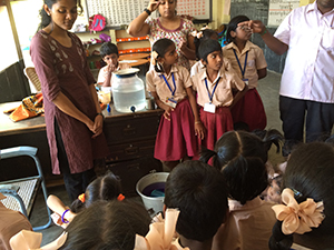 A teacher explains the importance of hand washing to elementary school students in Chennai. © Hygiene Heroes, 2015