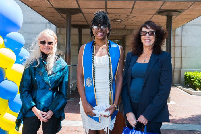 Victoria Osanyinpeju, a Conservation and Resource major, stands with Education Director Alice Agogino (left), and Annette Blum, daughter of Richard Blum (right) after receiving her diploma.