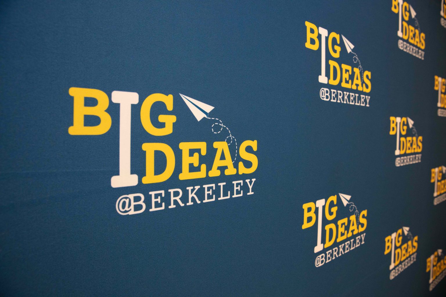 A "Big Ideas @ Berkeley" backdrop, prominently featuring the program's logo with a yellow and white text on a blue background.